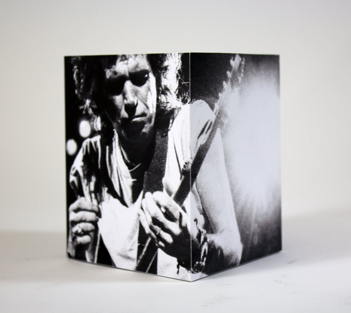 Closeup of a large box with a photo of Keith Richards playing guitar.